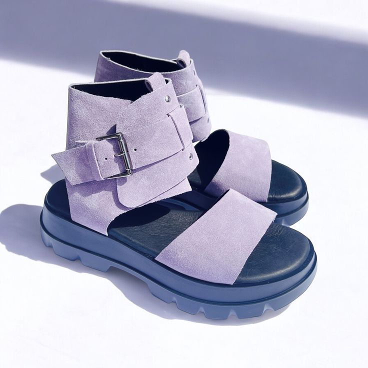 This highly favored model offers a stylish and comfortable option for everyday wear. The sandals feature a moderately soft and stable platform with a height of 3 cm at the front and 5 cm at the back. The design ensures a snug fit with an adjustable buckle around the ankle for added security. Available in a wide range of colors, these sandals not only provide exceptional comfort but also add a fashionable touch to your outfit. Materials: Genuine leather Sole: Stylish and flat Sole height: front 3 cm / back 5 cm Suitable for: Everyday use Additional features: Adjustable buckle for ankle Discover the perfect blend of style and comfort with our handmade black leather and patent leather platform sandals. These unique lace-up sandals are designed for the modern woman who values both elegance and Trendy Platform Sandals With Ankle Strap, Trendy Ankle Strap Platform Sandals, Trendy Flat Heel Platform Footbed Sandals, Spring Platform Flat T-strap Sandals, Adjustable Platform Sandals With Round Toe, Trendy Leather Sandals With Chunky Platform, Trendy Leather Footbed Sandals With Chunky Platform, Trendy Leather Flat Heel Footbed Sandals, Trendy Leather Footbed Sandals With Flat Heel