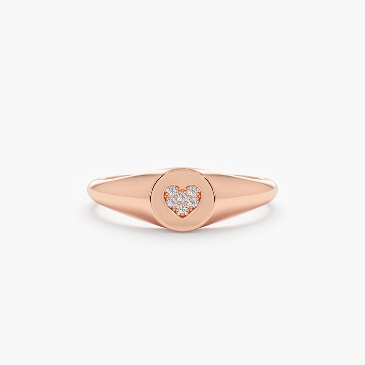 Kate Follow your heart, and it’ll lead you to our Signet Rings. This Signet ring is our modern take on the ever-so-classic ring. It's so delicate that it can even be worn on your pinky! Also, it would be a great gift for a new bride or a mommy. Shop our signet Ring Collection to celebrate all of the special people and moments of your life! - Handmade- Solid Gold- Natural Diamonds - G Color, SI Quality Diamonds- Total Diamond Carat Weight: 0.03 ctw- Ring Dimensions: 6 mm to 1.70 mm All pieces com Rose Gold Solitaire Ring For Valentine's Day, Promise Ring In Rose Gold With Single Diamond, Rose Gold Promise Ring With Single Diamond, Valentine's Day Single Diamond Ring In Fine Jewelry Style, 14k Rose Gold Promise Jewelry With Round Band, 14k Rose Gold Solitaire Promise Ring, Classic Heart Cut Signet Ring For Promise, 14k Gold Solitaire Heart Ring For Promise, 14k Gold Heart Ring With Single Diamond