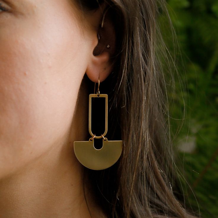 Our newest brass earring is a crisp, clean silhouette that adds a modern touch to your look. MATERIALS & DETAILS Brass Components Gold plated brass ear wires | Free of nickel, lead, and cadmium Minimalist Metal Plug Earrings For Everyday, Modern Matte Gold Earrings, Matte Gold Minimalist Metal Earrings, Matte Gold Minimalist Earrings, Modern Nickel-free Brass Hoop Earrings, Minimalist Gold-tone Pierced Earrings, Modern Metal Linear Earrings For Everyday Wear, Modern Metal Linear Earrings For Everyday, Modern Metal Plug Earrings For Everyday Wear