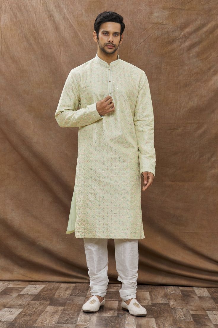 Mint green kurta with floral embroidery and front buttons. Paired with churidar.
Component: 2
Pattern: Embroidered
Type Of Work: Floral
Neckline: Jalsa Printed Kurta Set+D5:P5
Sleeve Type: Full Sleeves
Fabric: Cotton
Color: Green
Other Details: 
Floral motifs
Front buttons
Occasion: Mehendi,Puja - Aza Fashions Kurta Set For Men, Types Of Work, Luxury Sale, Churidar, Kurta Set, Full Sleeves, Floral Motifs, Green Cotton, Festival Wear