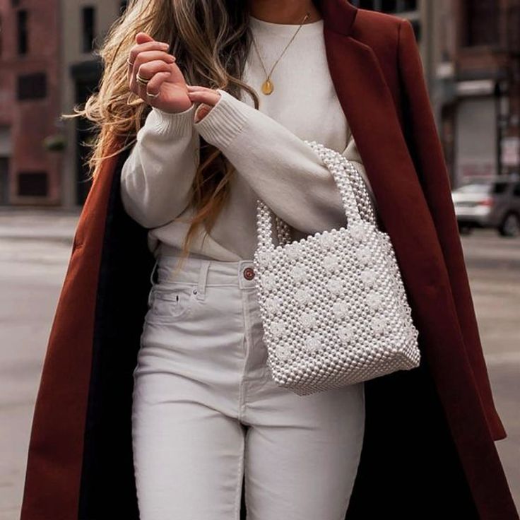 This cream Dominique beaded bag features a square body, round top handles, a beaded construction, an open-top design. This bag is the perfect feminine-chic touch to your look. Pair it with jeans for a casual stroll.PVC 100% Beige Shoulder Bag With Pearl Handle For Spring, Spring Beige Shoulder Bag With Pearl Handle, Chic Shoulder Bag With Pearl Handle For Spring, Trendy Spring Bags With Pearl Handle, Trendy Tote Shoulder Bag With Pearl Handle, Trendy Shoulder Bag With Pearl Handle For Shopping, Trendy Shopping Shoulder Bag With Pearl Handle, Trendy Pearl Handle Shoulder Bag For Shopping, Cream Bags With Pearl Handle For Spring