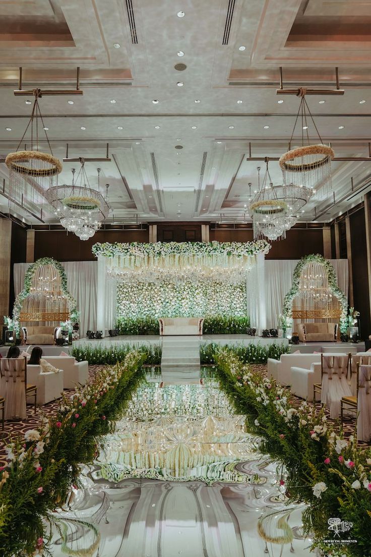 an elegant wedding setup with flowers and greenery