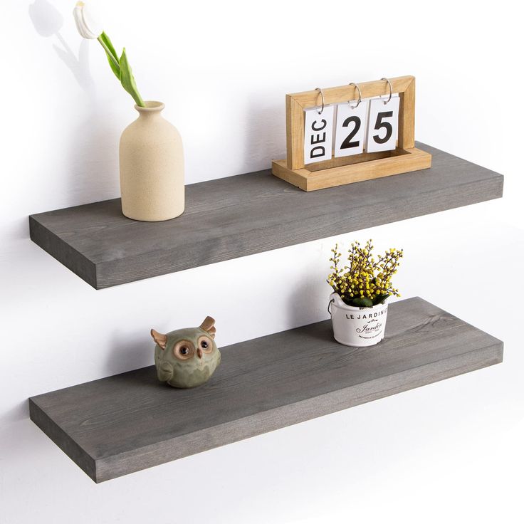 two wooden shelves with flowers and an owl figurine on them, both displaying the time