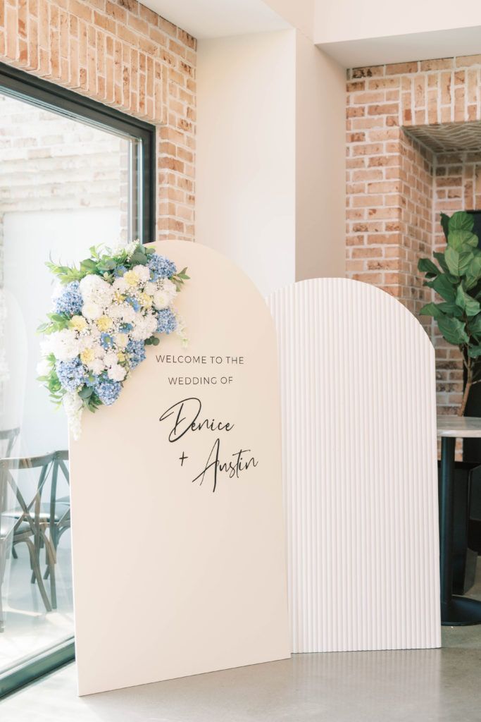 a sign that says welcome to the wedding of bride and groom with flowers on it