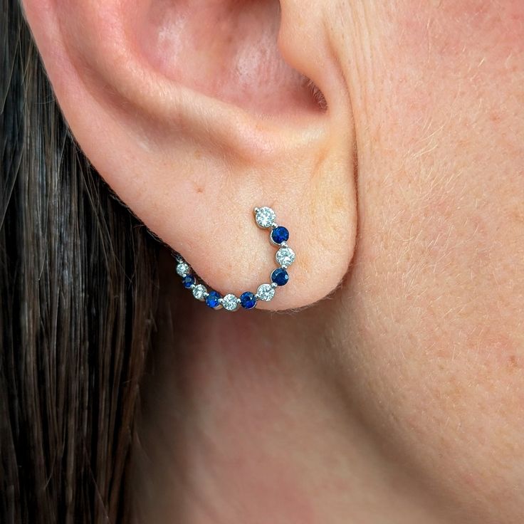 Curved huggies hoop earrings made with blue sapphire and diamonds this earring is perfect for everyday and is fully customizable so don't hesitate to ask for a no obligation quote for any custom requests you have in mind. Details - Solid 14k, 18k yellow, rose, white gold or platinum. - Default earring size is 11x13mm - Default friction back and post. Contact us if you want screw backs. - .33 total carat weight. Natural SI-G/H diamonds with natural blue sapphires. - Beautiful packaging, ready for gift giving. - Ships worldwide with end to end insurance. Custom Design These earrings are completely customizable beyond what we offer in the listing, from the size of the earrings to the type and shape of colored gemstones/diamonds used. Can't find what you're looking for? We also create custom d Blue Diamond Round Hoop Earrings, Blue Diamond Hoop Earrings, Blue Huggie Earrings For Anniversary, Blue Huggie Hoop Earrings In Fine Jewelry, Sapphire Hoop Earrings With Prong Setting, Blue Diamond Hoop Earrings Fine Jewelry, Blue Sterling Silver Round Huggie Earrings, Lion Pendant, Diamond Huggies