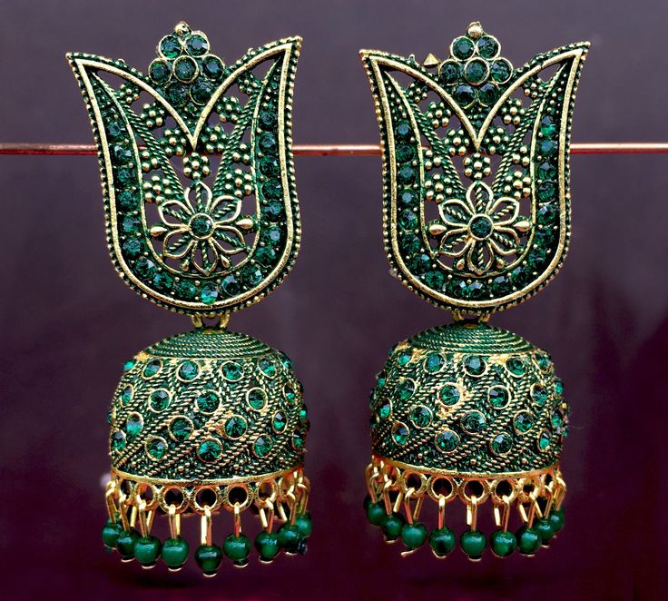 Perfect with ethnic & traditional wear. Fancy Party Wear Traditional Jhumki Earrings. Perfect gift for any occasion for yourself and your dear ones. It is advisable to store jewellery in a zip lock pouch (air tight pouch), keep away from water perfume and other chemicals and clean it with dry and soft cloth. Green Latkans Bridal Earrings For Diwali, Green Bridal Earrings With Latkans For Diwali, Green Latkan Bridal Earrings For Diwali, Green Bridal Earrings With Latkans For Festivals, Festive Green Jhumkas With Intricate Design, Bollywood Style Danglers For Eid, Traditional Green Bridal Earrings With Intricate Design, Party Temple Jewelry Meenakari Jhumkas, Green Bollywood Earrings With Zari Work