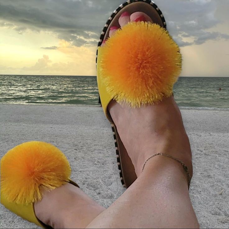 Verano Rio Summer Fluffy Yellow Pom Pom Flat Sandal Flip Flop It’s Summer & You Want To Have Fun With Your Shoe Wardrobe! Wear The Unexpected, Wow Your Friends, Express Your Weirdness & Make A Statement. This Summer Sandal Is All That! This Flat Mule Is Made Of All Faux Leather Materials & Runs True To Size. The Sandal Is Embellished With A “Poof” Decorative Explosion & The Insole Is Embellished W/ Chic Silver Rectangular Studs. Verano Rio Summer Yellow Pom Silver Stud Slipon Mule Sandals Yellow Slide Slides For Beach, Yellow Slides For Beach, Yellow Slides For The Beach, Yellow Summer Slides For Beach, Casual Yellow Slides For Vacation, Yellow Synthetic Slides For The Beach, Trendy Yellow Flip Flops For The Beach, Trendy Yellow Flip Flops For Beach, Yellow Round Toe Slides For Beach