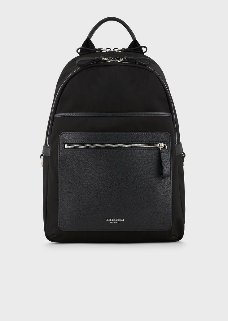 Find EMPORIO ARMANI Recycled-nylon And Pebbled-leather Backpack on Editorialist. This technical, well-equipped backpack combines performance and style. It adapts to the body, making it perfect for work or leisure time. Made from recycled nylon, it is enhanced by pebbled-leather details. The ideal accessory for all daily engagements, thanks to adjustable shoulder straps, a zip closure and outer zipped pockets. One Shoulder Backpack, Leather Backpack For Men, Armani Black, Latest Bags, Black Leather Backpack, Shoulder Backpack, Black Accessories, Leisure Time, Armani Men