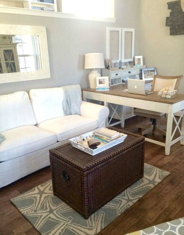 a living room filled with furniture and a coffee table