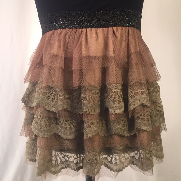 Tulle And Lace Skirt. Black Sparkled Stretchy Waist Band. Taupe/Brown Lace And Tulle Layered. Skirt Has Polyester Lining. Size Small/Medium. Never Worn. 100% Polyester. Beige Ruffled Skirt For Parties, Beige Tiered Skirt For Party, Bohemian Mini Length Bottoms For Party, Bohemian Style Mini Bottoms For Party, Beige Party Skirt With Ruffles, Beige Ruffled Party Bottoms, Tiered Fitted Mini Skirt For Party, Bohemian Ruffled Skirt For Party, Bohemian Party Bottoms With Ruffled Skirt