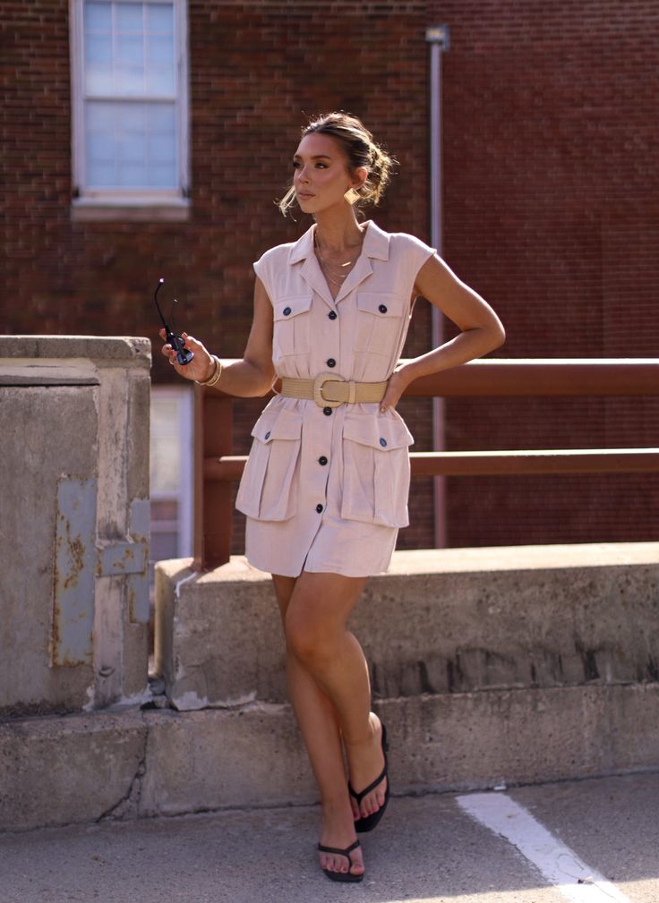 Casual meets sophistication with the Autumn Sands Cargo Dress. In a beautiful sand color, this dress is perfect for the autumn season. Featuring cargo-inspired details, including front pockets and a button down design, it's both functional and stylish! Fabric 70% rayon, 30% linen Khaki Mini Dress For Work, Chic Mini Shirt Dress With Pockets, Elegant Button-up Mini Dress With Pockets, Summer Workwear Khaki Mini Dress, Summer Khaki Mini Dress For Workwear, Summer Khaki Mini Dress For Work, Beige Mini Dress With Pockets, Taupe Spring Workwear Dress, Spring Neutral Collared Dress