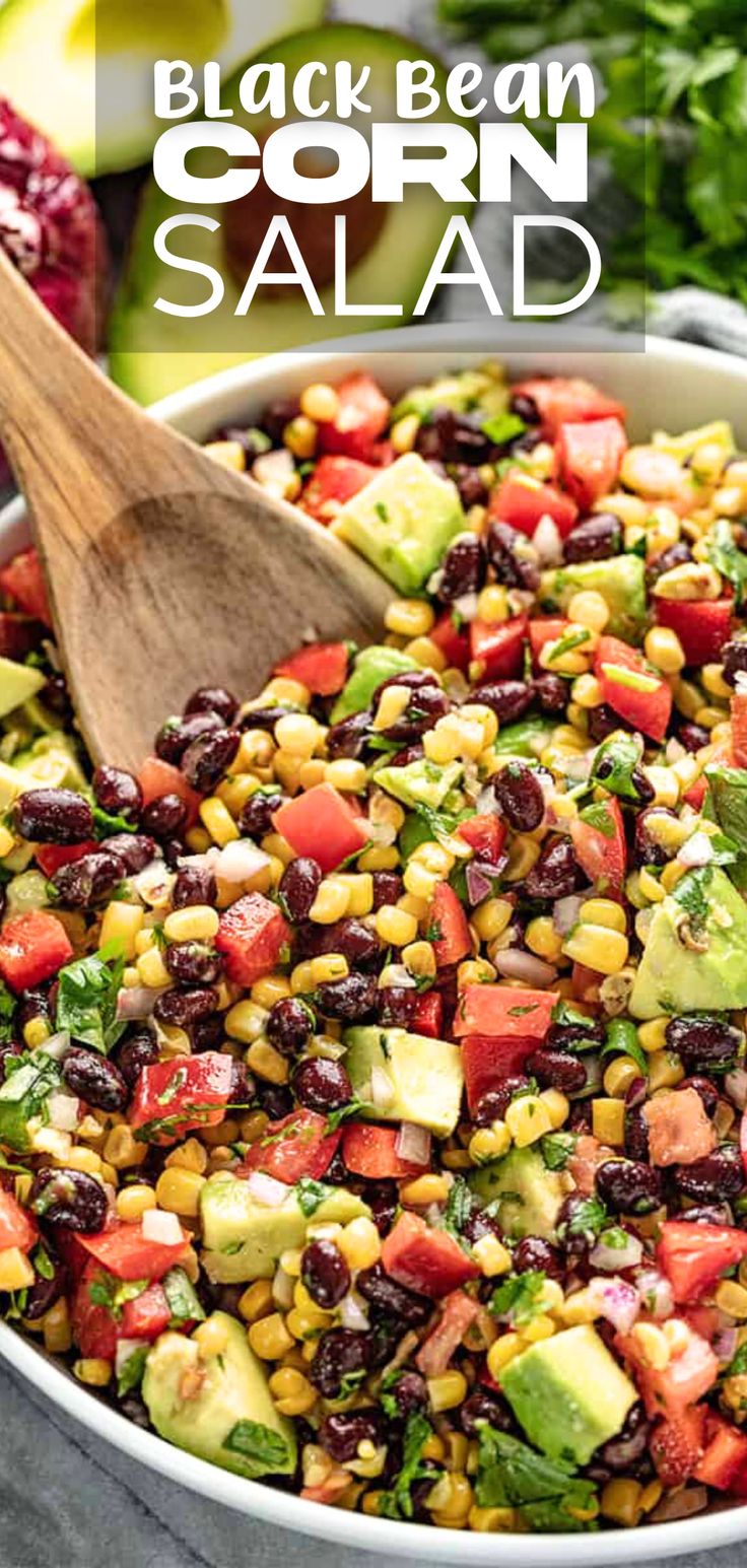 A close up view of a bowl of black bean and corn salad with avocado and cilantro. There's a wooden spoon in the salad bowl ready to serve out a helping. Corn Bean Avocado Salad, Black Bean Corn Cilantro Salad, Corn Salad Avocado, Corn And Beans Salad, Vegtables Sides Cold, Corn Bean Tomato Salad, Southwestern Black Bean Salad, Corn Broccoli Salad, Sides Dishes For Potluck