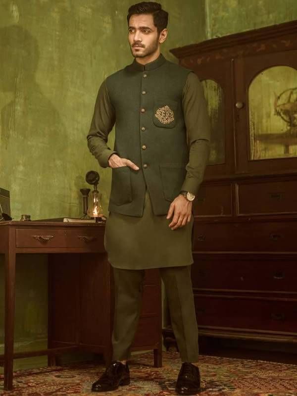 <p><strong>Waistcoat<br /></strong>Color:  Olive Drab<br />Fabric: PC Suiting Fabric<br />Designer embroidered waistcoat front<br />Fanciful front button closure<br /><br /><strong>Inner:</strong><br />Comes with field drab kurta and pajama<br /><br /><strong>Additional Accessories:<br /></strong>Peshawari Sandal / Khussa: <strong>US$30</strong></p> Canada View, Embroidered Waistcoat, Wedding Waistcoats, Mens Waistcoat, Men's Waistcoat, Groom Attire, Strong Colors, Call Whatsapp, London Uk