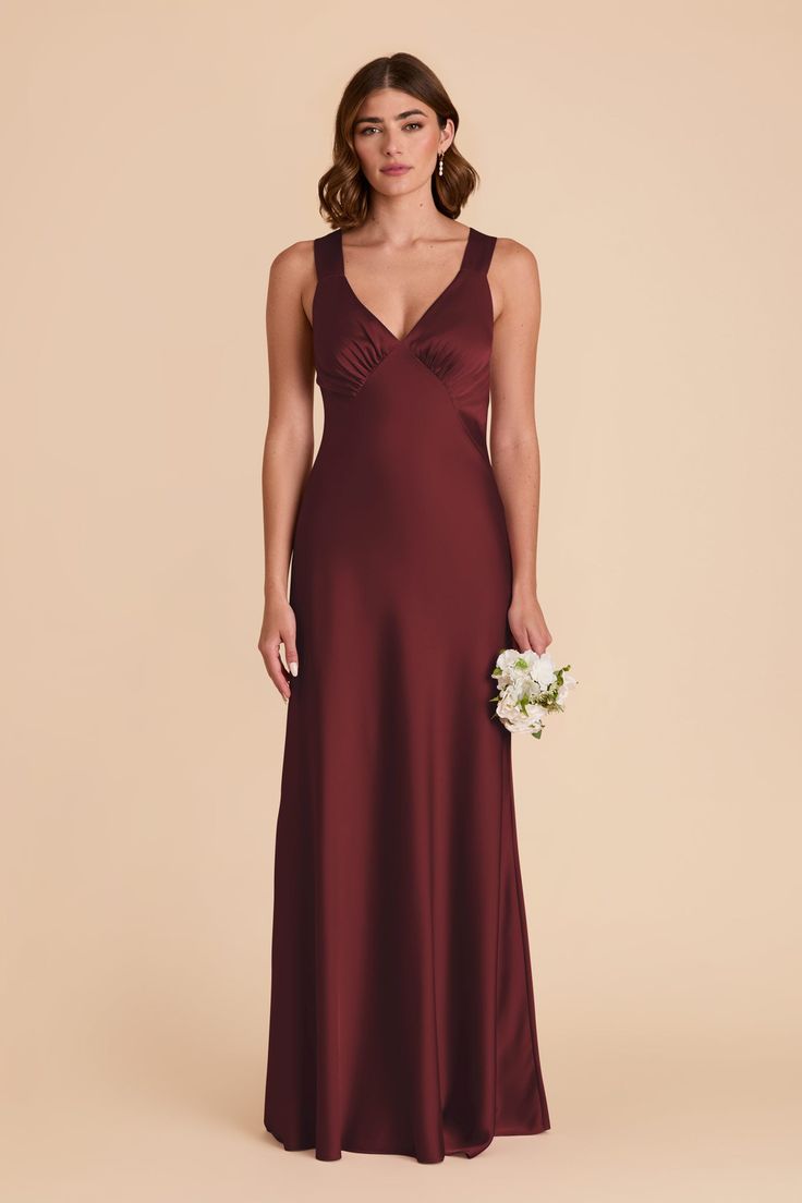 a bridesmaid in a long burgundy dress