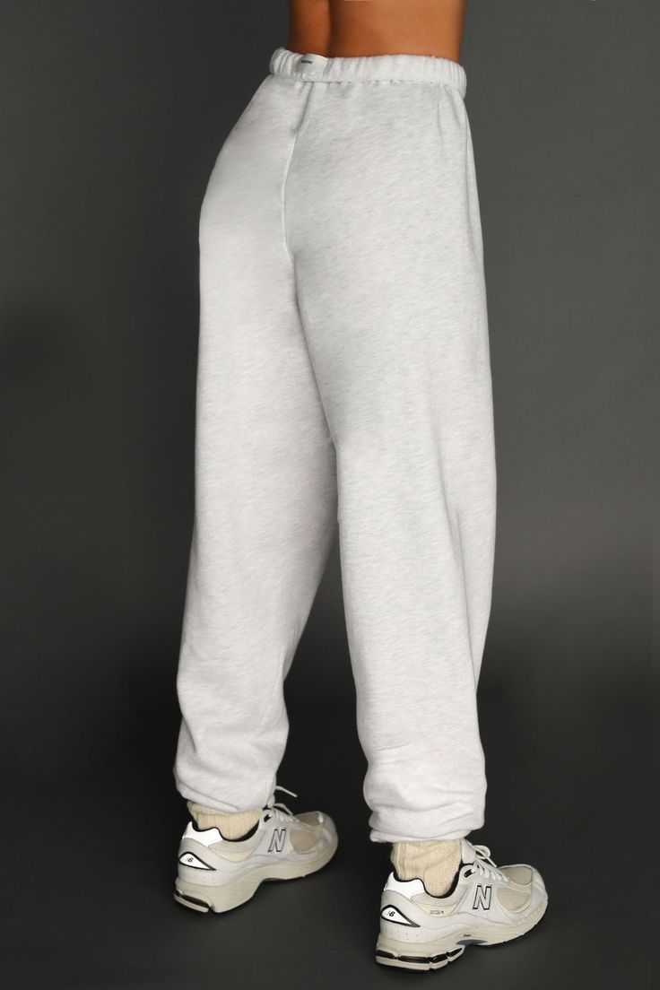 Jogger in an oversized silhouette with an elastic waistband and gathered ankle cuffs. Features an adjustable hidden drawstring at the waist. Custom knit french terry fabric Brushed mid-weight cotton - ideal for layering Soft, comfortable and made to last Color: Pearl Grey French Terry Sizing: X/S (0-2), S/M (4-6), M/L (8-10) Model is 5'8" and wearing size X/S Fabric: 98% Cotton, 2% Polyester Care: Machine Wash Cold With Like Colors.Care: Tumble Dry Low. Made in Los Angeles