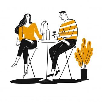 two people sitting at a table with drinks