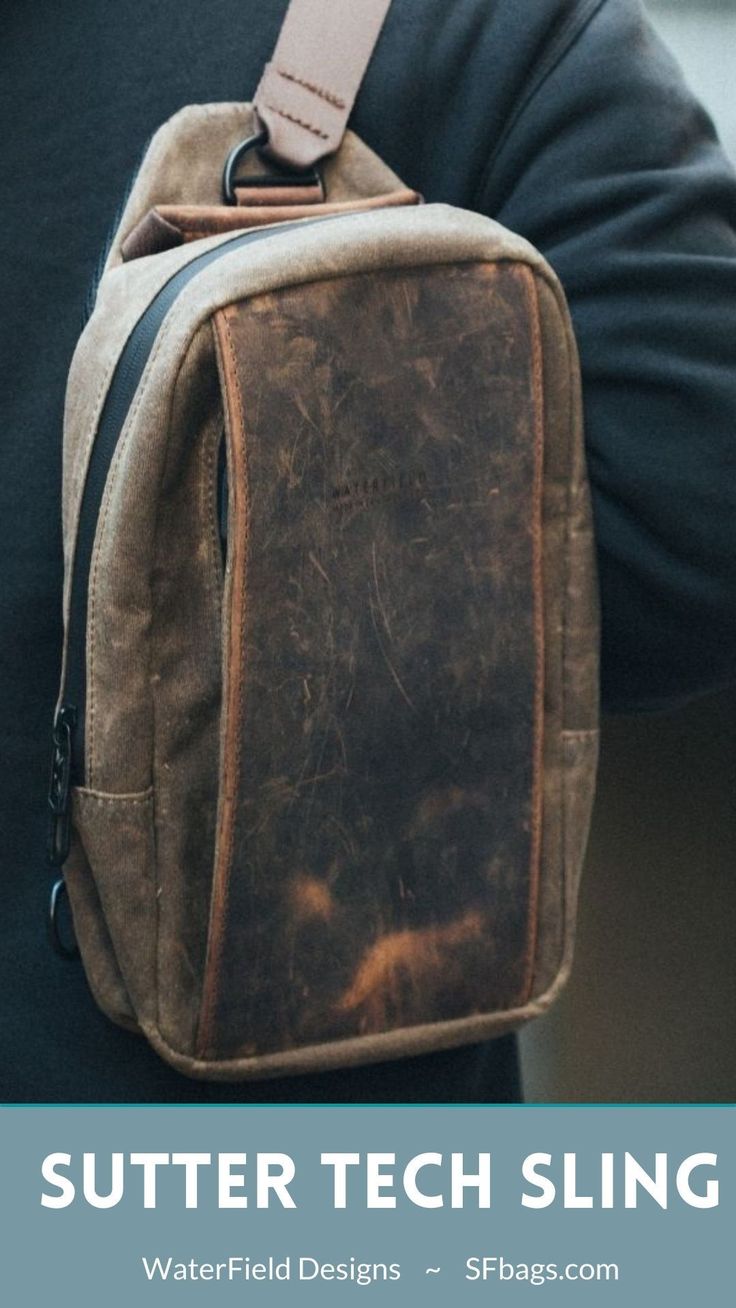 a man holding a brown bag with the words sutter tech sling on it