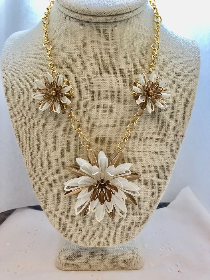 "Offering a gorgeous white and gold chain necklace which in its first life was an enamel gold and white Sarah Coventry daisy brooch and earrings. This is a real authentic vintage piece - not \"vintage inspired\" - it's the real deal! The necklace is a total of 19 inches in length. The brooch itself is 2.5 inches by 2.5 inches and the earrings are 1.5 inches each. Please remember that this assembled piece is over sixty years old - although gorgeous, it is not perfect. I describe my vintage pieces White Metal Jewelry For Weddings, White Metal Wedding Jewelry, Elegant Enamel Wedding Necklaces, Gold Metal Flower Necklace For Wedding, White Enamel Jewelry For Formal Occasions, Formal White Enamel Jewelry, White Chain Jewelry For Formal Occasions, Gold Flower-shaped Enamel Jewelry, Gold Enamel Flower Jewelry