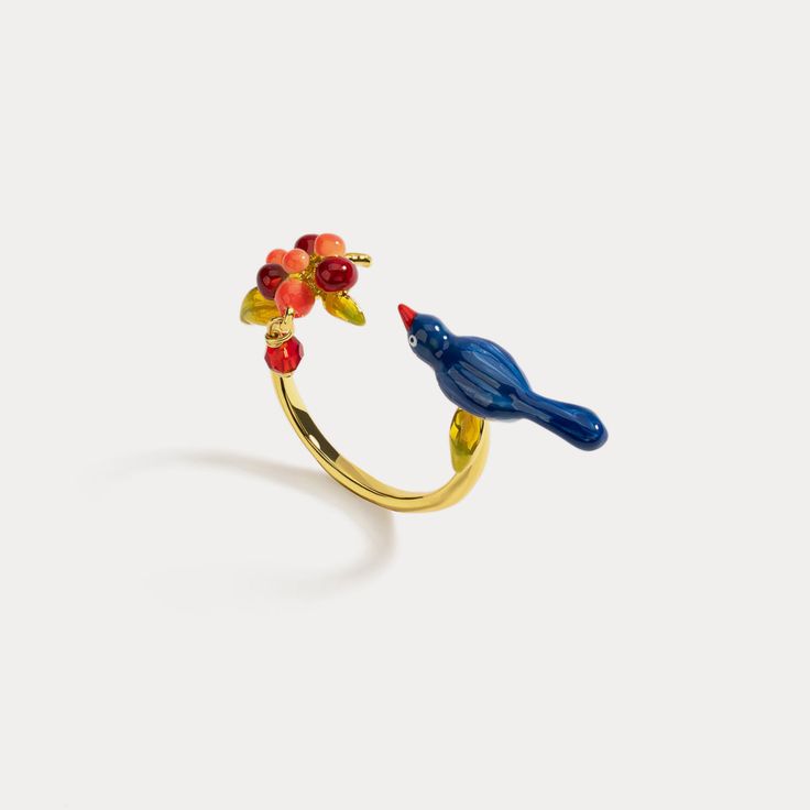 Pair of Lovebirds Ring is a piece of fine jewelry from Selenichast jewelry store and it is an adjustable ring made from 18k gold and enamel paint. It’s a good gift for someone who loves nature and birds. What a gorgeous ring that is designed exclusively for people to declare their love and passion. This romantic adjustable ring is composed of a lovebird with a blooming flower or rosy berries. A unique creation, exquisite enameled workmanship offers it more detailed beauty while flowery elements Simple Gift Wrapping, Women Flower, Jewelry Accessories Ideas, Animal Rings, Whimsical Fashion, Funky Jewelry, Enamel Ring, Enamel Paint, Cute Rings