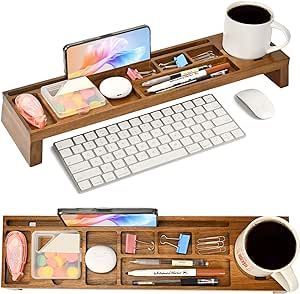 a wooden desk with a keyboard, mouse and other office supplies on top of it