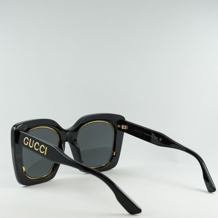 Indulge in the luxury and sophistication of Gucci with the stunning GG1151S 001 Black/Grey sunglasses. These iconic butterfly-shaped frames exude elegance and style, perfect for the fashion-forward woman who wants to make a statement. Crafted from high-quality acetate, the black frame is sleek and modern, while the grey lenses add a touch of mystery and allure. The classic color combination of black and grey never goes out of style, making these sunglasses a timeless addition to your accessory collection. With a lens socket width of 51mm and a bridge size of 23mm, these sunglasses are designed to fit comfortably and securely on your face. The temple length of 145mm ensures a perfect fit for all-day wear, whether you're running errands or lounging by the pool. The Gucci GG1151S 001 Black/Gr Elegant Wayfarer Shield Sunglasses With Uv Protection, Designer Sunglasses With Uv Protection For Party, Trendy Sunglasses With Uva Protection For Formal Use, Trendy Sunglasses With Uva Protection For Formal Occasions, Designer Gucci Shield Sunglasses With Mirrored Lenses, Designer Sunglasses With Mirrored Lenses For Parties, Designer Matte Black Sunglasses With Uv Protection, Designer Party Sunglasses With Mirrored Lenses, Trendy Formal Sunglasses With Uv Protection