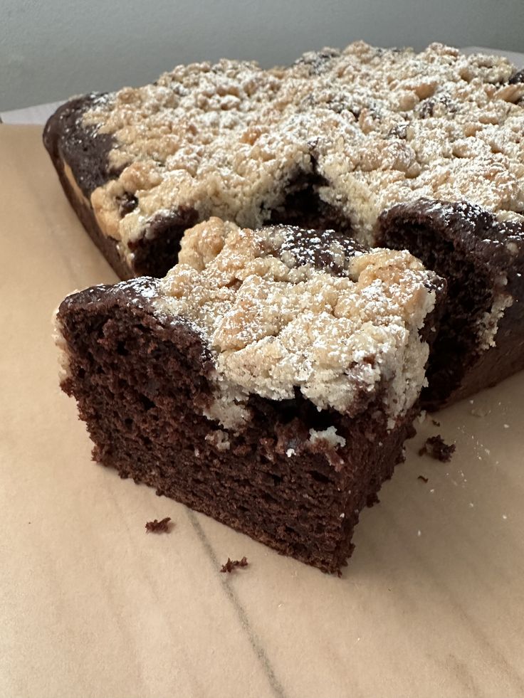 two pieces of cake sitting on top of a table