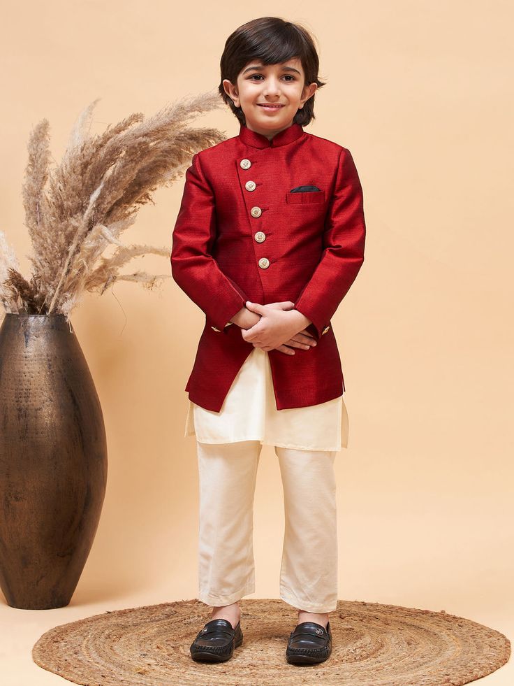 VASTRAMAY Boy's Maroon Indo Western Jacket With Cream Kurta And Pyjama Set Discover the perfect blend of tradition and style with the VASTRAMAY Boy's Maroon Indo Western Jacket With Cream Kurta And Pyjama Set. Crafted to impress, this outfit is ideal for special occasions, offering comfort and sophistication. Features Traditional Indo Western design Includes maroon jacket, cream kurta, and pyjama Perfect for festive and celebratory occasions Specifications Color: Maroon and Cream Material: High- Ceremonial Red Sets With Dabka Detail, Festive Long Sleeve Winter Sets, Red Long Sleeve Bandhgala For Winter, Winter Wedding Sets With Pallu, Long Sleeve Nehru Jacket For Diwali Festival, Winter Bollywood Style Kurta With Long Sleeves, Red Winter Wedding Sets, Red Wedding Sets For Winter, Ceremonial Long Sleeve Sets For Diwali