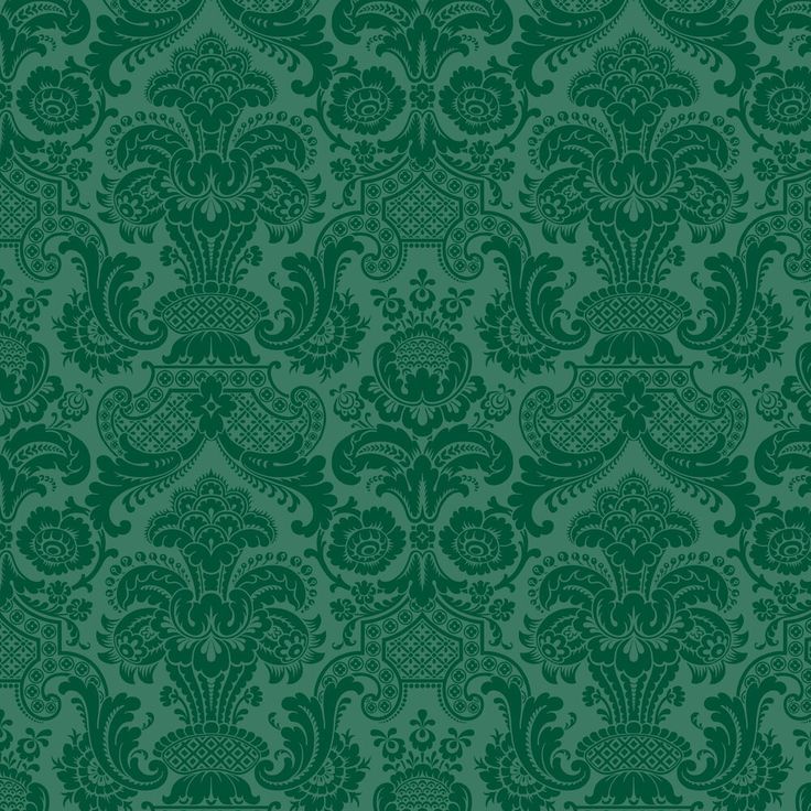 a green wallpaper with an ornate design