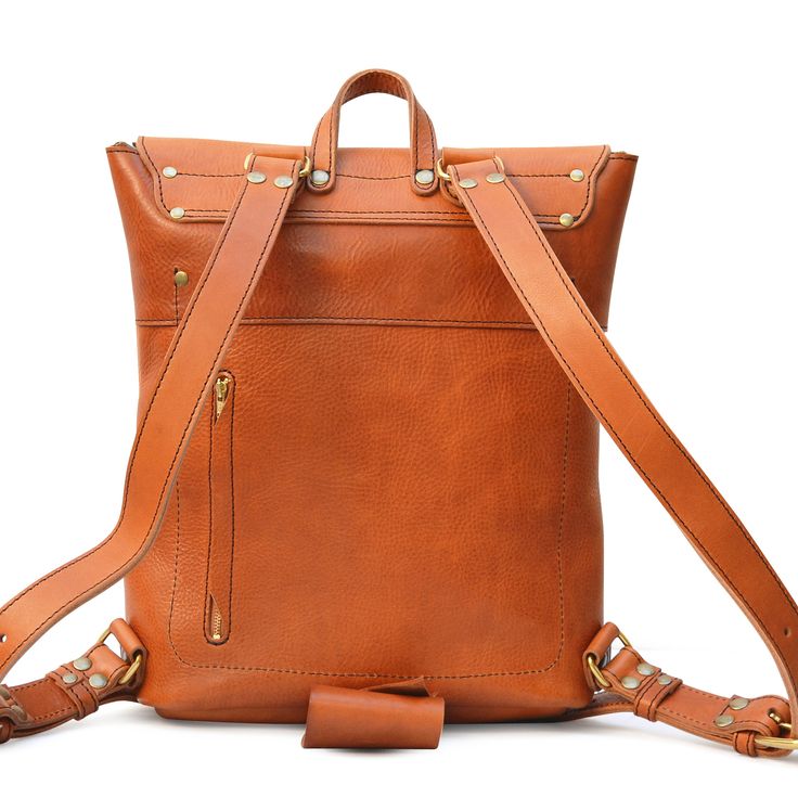 The Marlondo Leather Rucksack has been updated with a new, softer leather. It features the same great, efficient design but we are utilizing a softer, pebbled/tumbled full grain vegetable tanned cowhide leather. The result is a fantastic rucksack with a great feel and texture to it. Right out of the box it has a broken-in feeling as if you've been using it for years already. Smaller and lighter than our full-size Backpack, the Marlondo Leather Rucksack is rugged, yet refined. This veg-tan leathe Daily Carry, Minimalist Backpack, Tan Cowhide, Leather Rucksack, Veg Tan Leather, Brass Buckle, Everyday Items, Cowhide Leather, Tan Leather