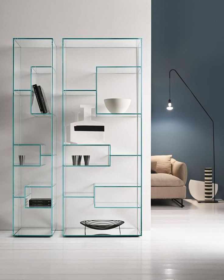 a modern book shelf with glass shelves in the middle