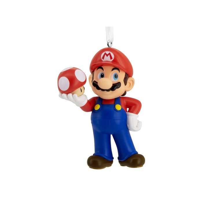 an ornament shaped like mario is holding a mushroom