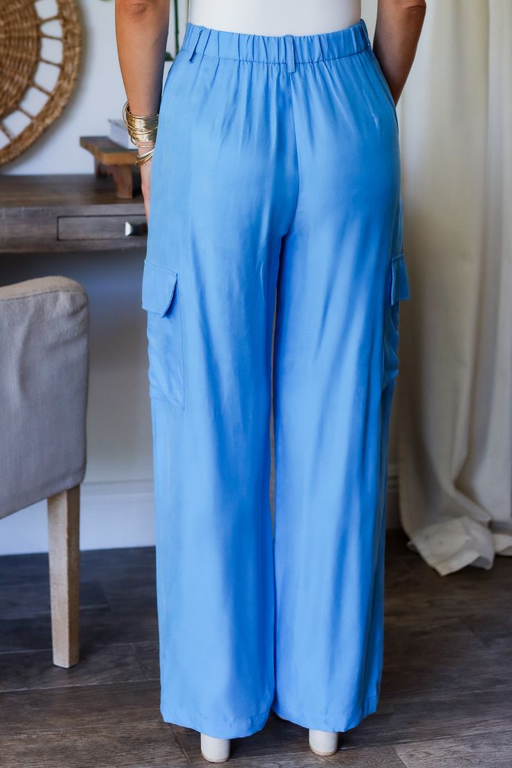 Get ready to strut your style this spring with our Laura cargo pants! With a gorgeous electric blue shade, these pants will add a pop of color to any outfit. Plus, their cargo design provides plenty of pockets for all your essentials. Step out in style and functionality with Laura! 100% Rayon Color: Flat Blue with Shimmer Button/ Zipper Closure Multi Pockets Half Elastic Waist BAND Light Weight Utility Cargo Style Straight Leg Belt Loops True to size Model is wearing a size Small. She is 5'6". 1 Cargo Design, Leg Belt, Cargo Style, Pants Large, Blue Flats, Stepping Out, Waist Band, Cargo Pants, Electric Blue