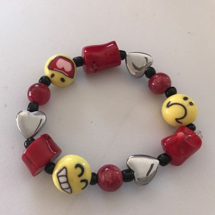 Fun Red & Yellow Emoji & Heart Beaded Bracelet On Stretch Cord, Laser Sealed. Handmade Red Novelty Beaded Bracelets For Friendship, Casual Multicolor Bracelets For Valentine's Day, Red Stretch Bracelet For Friendship In Trendy Style, Trendy Red Stretch Bracelet For Friendship, Fun Red Bracelet Gift, Fun Red Bracelet For Gift, Playful Red Stretch Bracelet For Gift, Playful Red Beaded Bracelets For Friendship, Red Adjustable Fun Beaded Bracelets