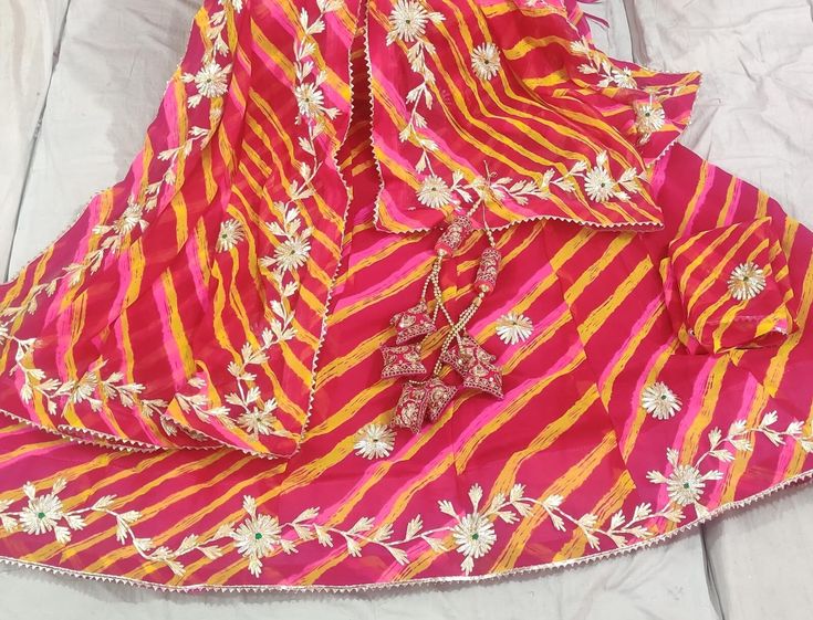 Beautiful multi colour Leheriya Lehenga chuni set Gorjett Leheriya Lehenga with full heavy kachi gotta Patti work with full stiched with full touch atteched cotton aster    Gorjett Leheriya duptta with Heavy kachi gotta Patti work  full 2.5 mitr size  Lehanga in beautiful Multi colours combination   unstiched Blouse same lahnge jesa jorjett fabric with work 90 cm. Lahenga Flair 3 mitr Length 41 to 42 Waist. 42 to 44 Sets With Zari Work For Navratri Celebration, Saree Sets For Navratri Celebration, Bollywood Style Sets For Navratri Celebration, Bollywood Style Navratri Celebration Sharara, Navratri Celebration Saree Set, Navratri Celebration Set With Zari Work, Multicolor Bandhani Print Chanderi Choli, Festival Celebration Saree Set, Festival Celebration Sets With Dupatta