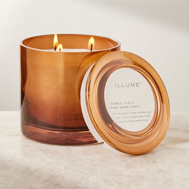 Designed as a centerpiece item, triple-wick candle by Illume builds upon a base of warm cashmere musk with notes of tobacco leaf and sweet orange. The soy wax blend is hand-poured into a dark amber glass vessel with an ombre effect that's nothing short of mesmerizing when flames flicker within.  -Handmade -Soy and paraffin wax blend -Three lead-free wicks -Vegan and cruelty-free -Green glass vessel with matte brass lid -20.8 ounces -Burn time of up to 60 hours -Trim wick to 1/4andamp;quot; befor Label Candle, Smelling Candles, White Pillar Candles, Orange Candle, Spring Inspo, Glass Cloche, Candles For Sale, Wick Candle, Candle Diffuser