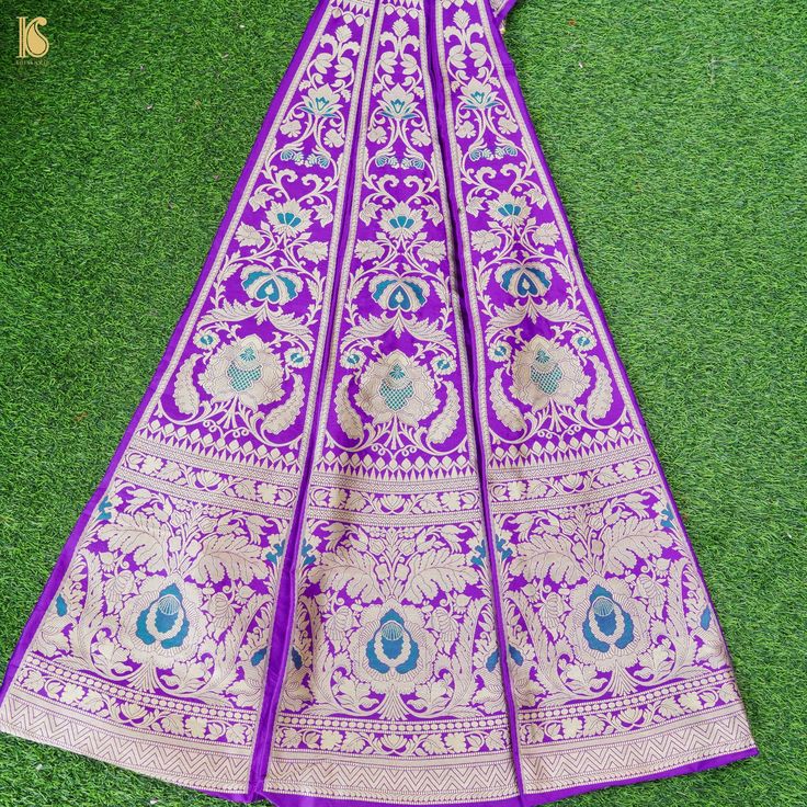 Make your special occasion even more memorable with our exquisite collection of Kalidar Banarasi lehengas. Crafted with pure silk and intricate handwoven designs, these lehengas are sure to turn heads and leave a lasting impression. Perfect for weddings, receptions, and other festive celebrations, a Kalidar Banarasi lehenga is a must-have in every woman's wardrobe. Banarasi Silk Meenakari Choli For Reception, Jamawar Dupatta For Reception And Festivals, Katan Silk Saree With Zari Weaving For Reception, Jamawar Traditional Wear For Reception And Festivals, Unstitched Banarasi Silk Sharara For Reception, Floor-length Dola Silk Traditional Wear With Meenakari, Floor-length Meenakari Dola Silk Saree, Banarasi Silk Lehenga With Meenakari For Reception, Raw Silk Choli With Zari Weaving For Reception