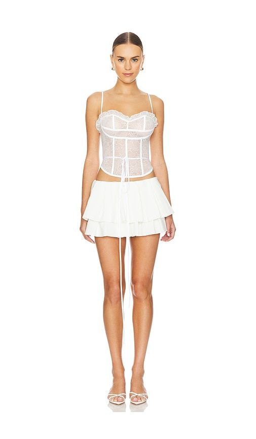 Find KIM SHUI Bustier Top on Editorialist. Kim Shui Bustier Top in White. - size L (also in M, S, XS) Kim Shui Bustier Top in White. - size L (also in M, S, XS) 100% nylon. Made in China. Machine wash. Back lace-up tie closure. Boned bodice. Lightweight delicate lace fabric. Garment is intentionally sheer, undergarments will show through. KIMR-WS56. KS2023H07. Recently named on the Forbes 30 under 30 list, designer Kim Shui ventured out on her own in 2016 to found her New York City based brand - and has been reaching new heights ever since. After winning VFiles Runway for NYFW in 2016, her luxe, abstract, and eccentric pieces have caught the attention of fashionable celebs such as Kylie Jenner, Lizzo, Kehlani, and Bella Hadid. Striving for inclusivity everywhere, Kim Shui believes every gi Flirty Fitted Corset With Built-in Bra, Evening Corset Belt With Built-in Bra, Flirty Fitted Corset With Boned Bodice, Fitted Flirty Corset With Boned Bodice, Flirty Fitted Sleeveless Corset, Fitted Underbust Bodice, Flirty Fitted Overbust Corset, Chic Fitted Corset Belt With Built-in Bra, Fitted Flirty Overbust Corset