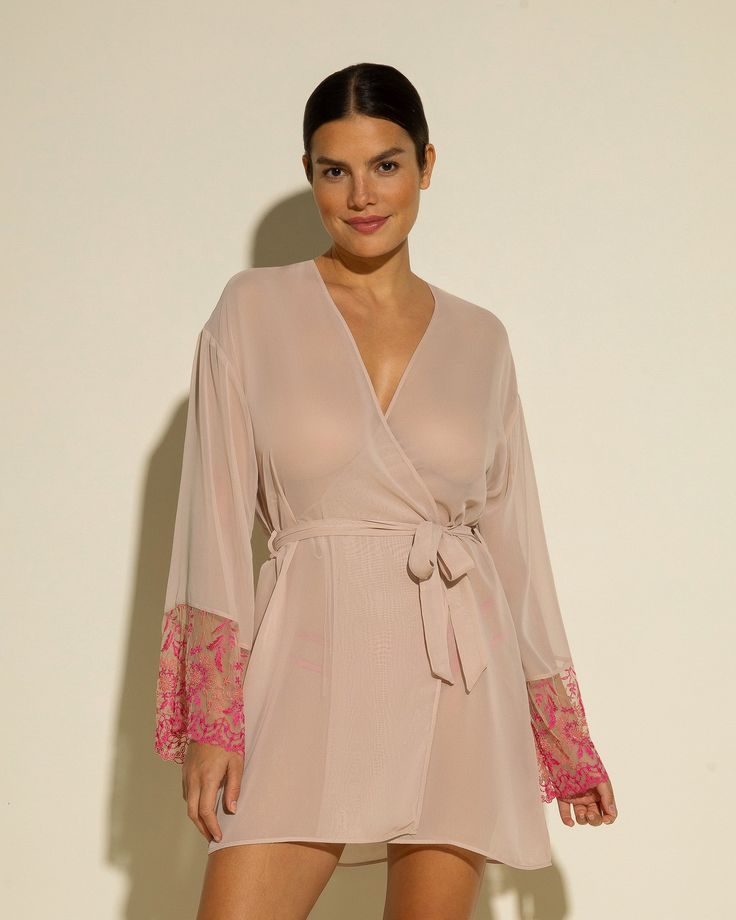 Sheer robe with lace sleeves. Beautifully detailed rigid semi-sheer lace. Mid-thigh length. Removable tie at waist. Lace trimmed long sleeves. Hand wash, do not dry in dryer. Spring Sheer Long Sleeve Kimono, Long Sleeve Lace Sleepwear For Loungewear, Long Sleeve Lace Sleepwear For Lounge, Lace Long Sleeve Sleepwear For Wedding Night, Daywear Long Sleeve Kimono With Tie Waist, Sheer Lace Long Sleeve Sleepwear, Feminine Long Sleeve Lace Sleepwear, Long Sleeve Lace Robe With Lace Trim, Elegant Long Sleeve Sheer Sleepwear