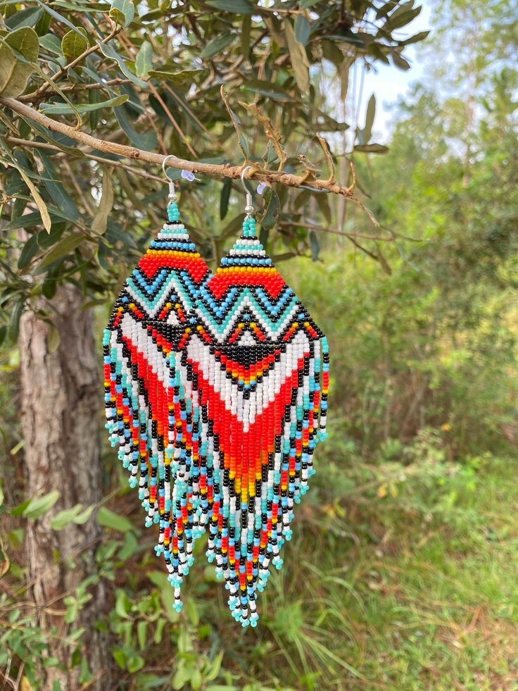 Colorful Native American Style Beaded Earrings. Hippie, boho, Tribal  Made with good vibes... Bohemian Teardrop Beaded Earrings With Colorful Beads, Bohemian Multicolor Teardrop Jewelry, Multicolor Teardrop Bohemian Jewelry, Bohemian Beaded Drop Earrings With Ear Wire, Hippie Beach Earrings For Summer, Bohemian Teardrop Beaded Earrings For Pierced Ears, Hippie Style Summer Beach Earrings, Southwestern Style Round Bead Earrings For Festivals, Southwestern Style Beaded Dangle Earrings For Festival