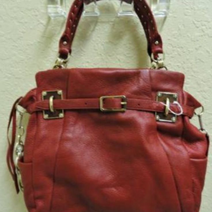 Elliott Lucca Red Leather Handbag Large Satchel Buckle Belt Accent Handles With Gold Studs Running Across Each Adjustable Shoulder Strap Has Gold Chain Link Accents Full Top Zipper Closure One Large Interior Zipper Pocket Two Pockets For Cell Phone And Glasses Red Elliot Lucca Leather Handbag Gorgeous Supple Genuine Leather Bucket Bag Style Measures 16" X 11" X 4" Double Handles Nwot - Never Used Red Leather Satchel With Metal Hardware, Designer Red Bags With Silver-tone Hardware, Designer Red Shoulder Bag With Metal Hardware, Red Tote Shoulder Bag With Silver-tone Hardware, Red Leather Shoulder Bag With Metal Hardware, Red Bags With Metal Hardware For Everyday Use, Red Shoulder Bag With Metal Hardware For Travel, Red Rectangular Hobo Bag With Gold-tone Hardware, Red Rectangular Satchel With Silver-tone Hardware