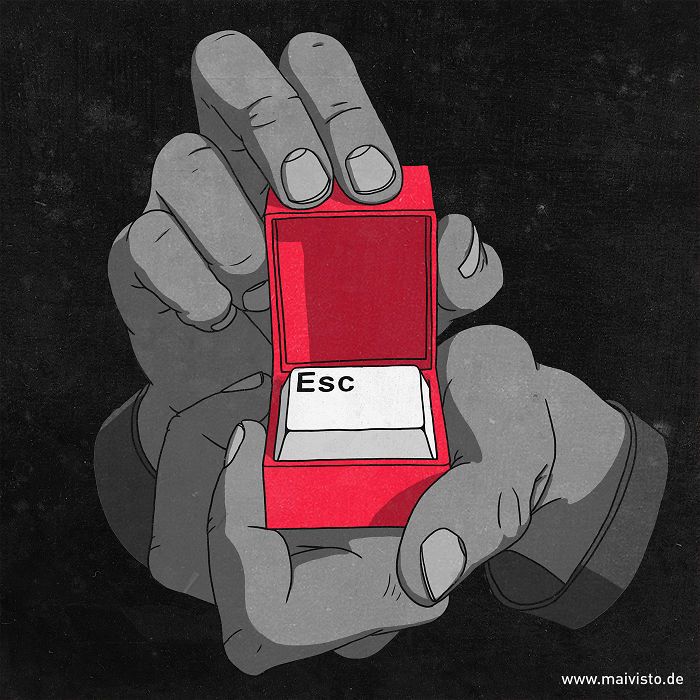 a person holding a red box with the word esc on it in their hand