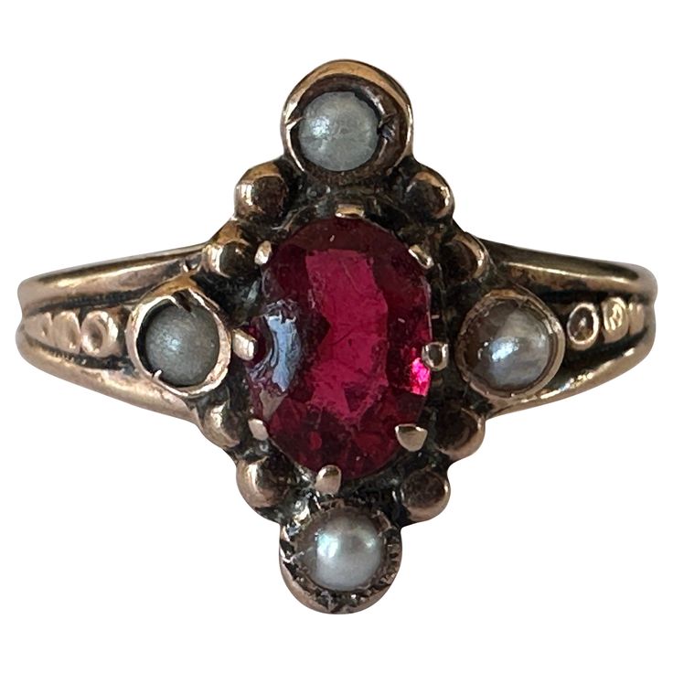 Crafted in the late nineteenth century, this antique navette shaped dinner ring is designed around an oval red garnet and accented by four seed pearls. Set in 10K rose gold. Vintage Gold Rings Victorian, Antique Victorian Engagement Rings, Garnet Diamond Ring, Odd Wedding Rings, Odd Engagement Rings, Victorian Era Engagement Rings, Gothic Wedding Rings Engagement, Garnet Engagement Ring Vintage, Victorian Rings Engagement