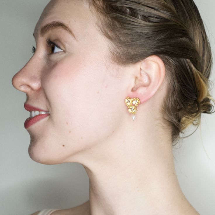 Delicate and charming, the detail of these unique Eric et Lydie earrings will steal your heart away. They are the perfect length for making an elegant, sweet statement. Scoop up theses charming earrings today. 1"L x .75"W 14K gold plated brass, Swarovski crystals, drop pearl, hypoallergenic posts Handmade in France by Eric et Lydie More about Eric et Lydie: Surprise and delight are two of the most important reactions I must feel when "discovering" a new artist. Without it I wouldn't present thei Feminine Heart-shaped Wedding Earrings, Heart-shaped Clip-on Wedding Earrings, Wedding Heart Drop Earrings Single Piece, Wedding Heart-shaped Clip-on Earrings, Feminine Yellow Gold Wedding Earrings, Elegant Pierced Heart Earrings For Wedding, Elegant Heart-shaped Flower Earrings For Gifts, Flower Drop Earrings, Pearl Flower