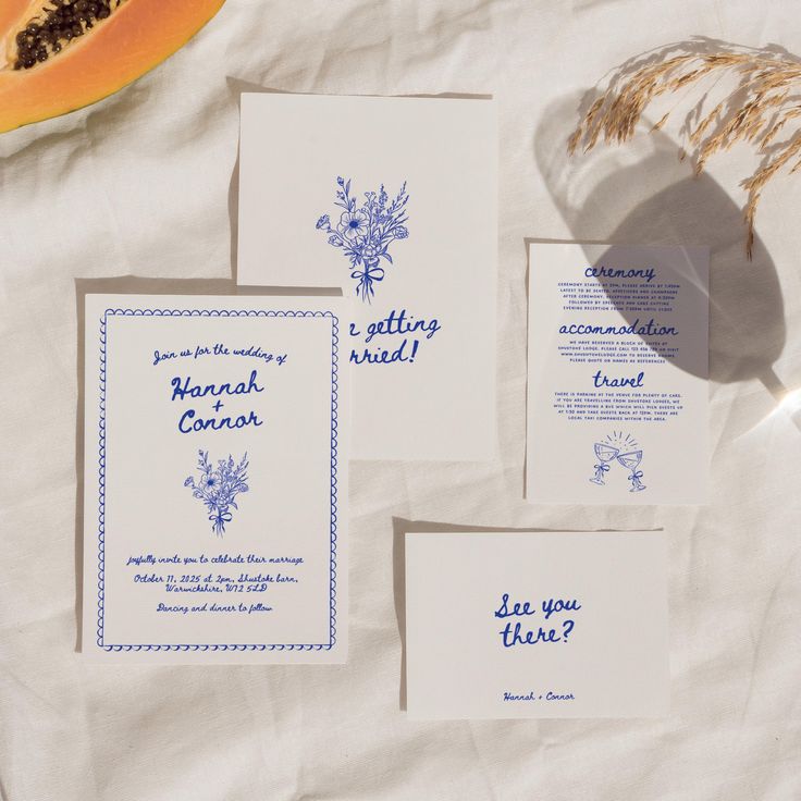 the wedding stationery is laid out on paper