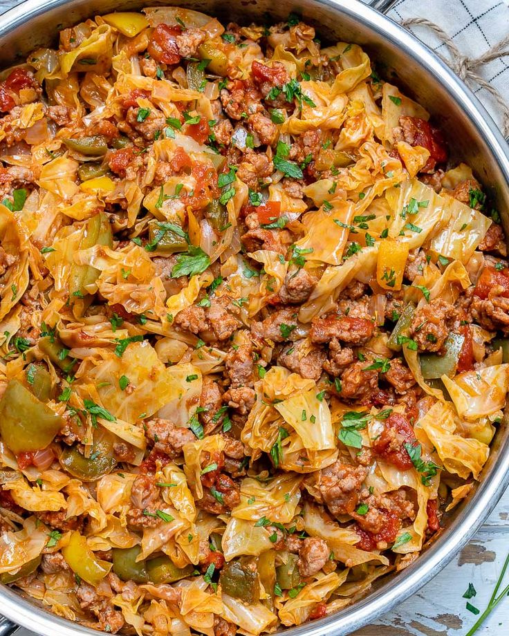 a large pot filled with pasta and meat