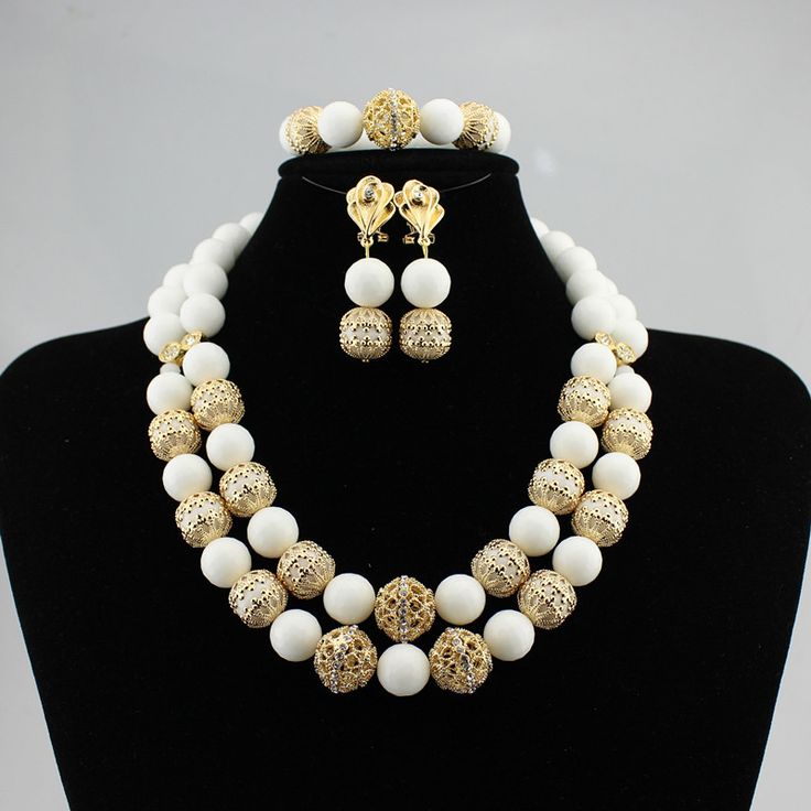 Make your wedding day truly memorable with our custom-made bridal jewelry set. White Bridal Necklace With Elegant Design, Classic White Jewelry Sets For Wedding, Classic White Hand Set Bridal Necklace, Classic White Bridal Sets For Wedding, White Jewelry Sets For Wedding, Classic White Jewelry Sets With Elegant Design, Classic White Jewelry Set With Elegant Design, White Bridal Sets For Formal Occasions, Elegant Gold Jewelry Set With Round Beads