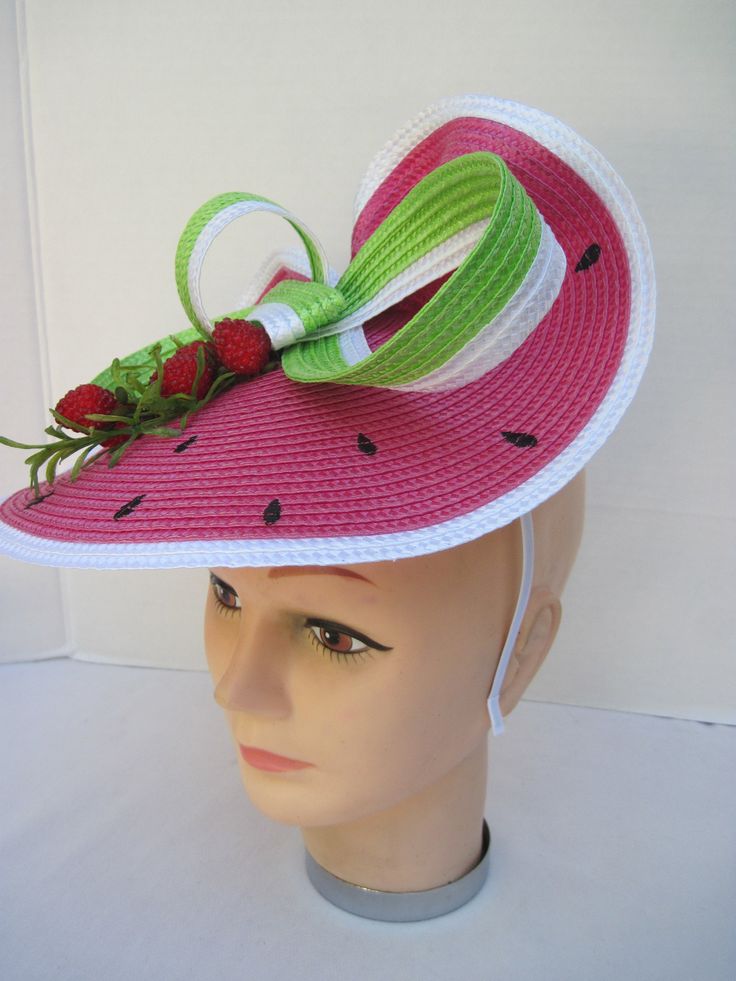 "* This design features the watermelon braiding as the hat foundation folded into design loops complemented by red raspberries and summer greens. * The hat form is about 12\" folded in back and tilted in a sophisticated design. * It is light weight, balanced and comfortable to wear year round. * Designed on a satin covered metal headband, it fits just about any head size and when viewed from any direction it looks complete, striking and eye catching. * Wear it throughout the year for special eve Pink Summer Costume Hats And Headpieces, Fun Pink Costume Hats And Headpieces For Summer, Green Summer Boater Hat With Flat Brim, Whimsical Adjustable Straw Hat For Summer, Green Boater Hat With Flat Brim For Summer, Green Flat Brim Boater Hat For Summer, Green Adjustable Hat Bands For Kentucky Derby, Adjustable Green Hat Bands For Kentucky Derby, Adjustable Green Hat Band For Kentucky Derby