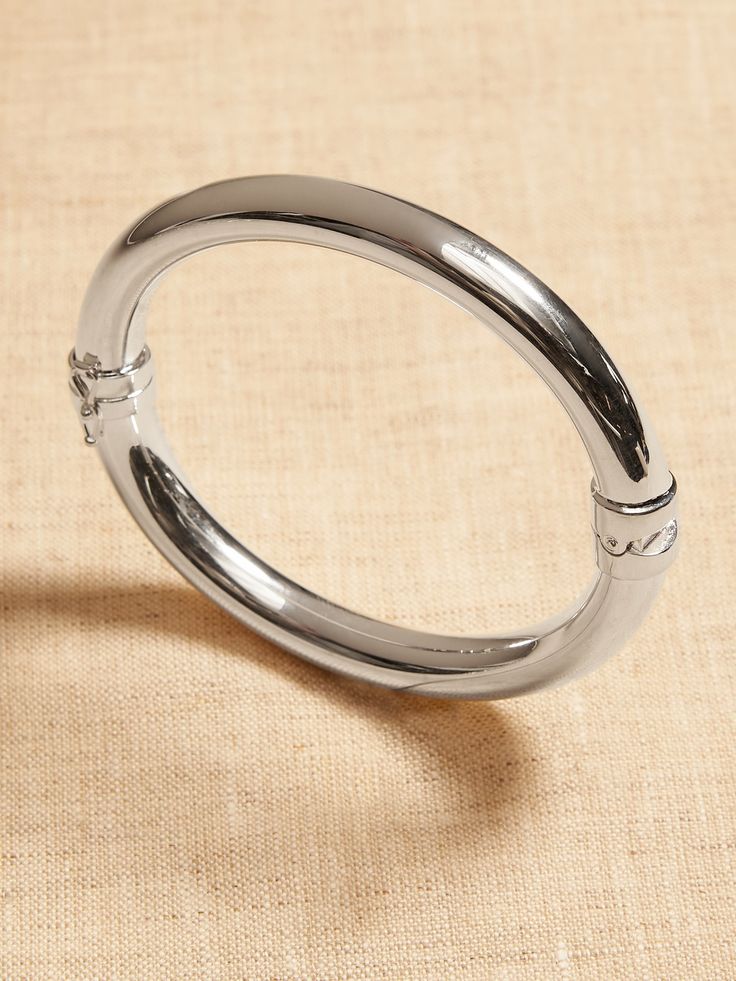 TIMELESS CLASSICS COLLECTION: Luxury, everyday.  A showcase of time-honored craftsmanship and skilled artisans from Italy to India, these are the pieces you'll reach for season after season, delighting in their exceptional versatility and endless app Timeless Silver Bracelet With Shiny Finish, Elegant Silver Jewelry With Smooth Finish, Modern Polished Sterling Silver Bangle Bracelet, Modern Engraved Oval Link Bracelets, Sleek Polished Bangle Jewelry, Timeless Oval Silver Bracelets, Modern Oval Bracelets With Polished Finish, Modern Engraved Bracelets With Oval Links, Modern Sterling Silver Bracelet With Polished Oval Link