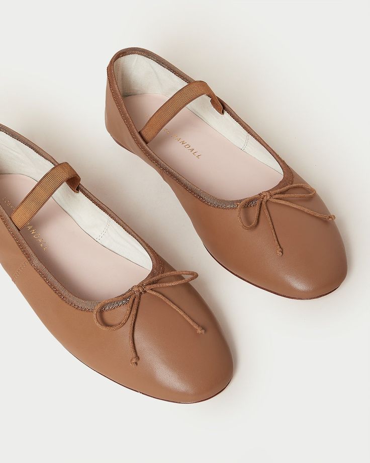 Soft ballet flat in safari tan glove calf leather with an elastic bridge strap and bow detail. Features a padded footbed with gold stamped logo and an almond toe. Cream Ballet Flats, Soft Ballet Flats, Pink Ballet Flats, Black Leather Ballet Flats, Tan Flats, Chocolate Leather, Black Ballet Flats, Womens Ballet Flats, Loeffler Randall