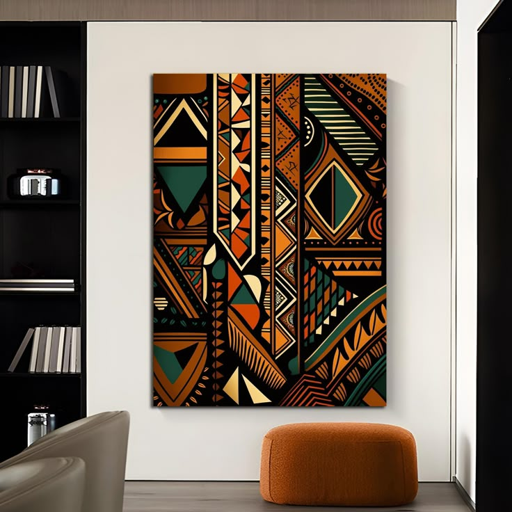 an abstract painting hangs on the wall next to a chair